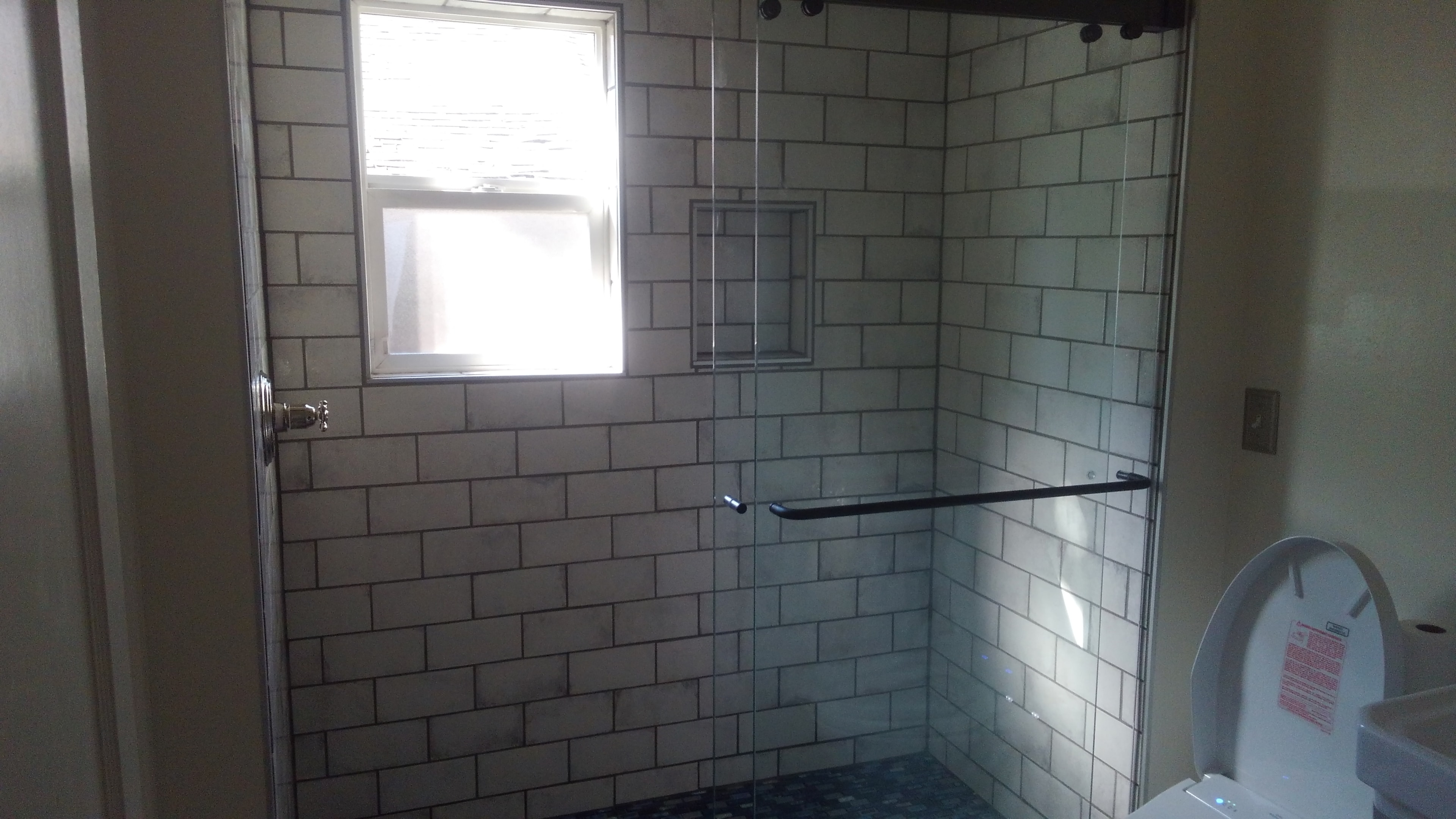 Subway tile shower interior with built-in niche