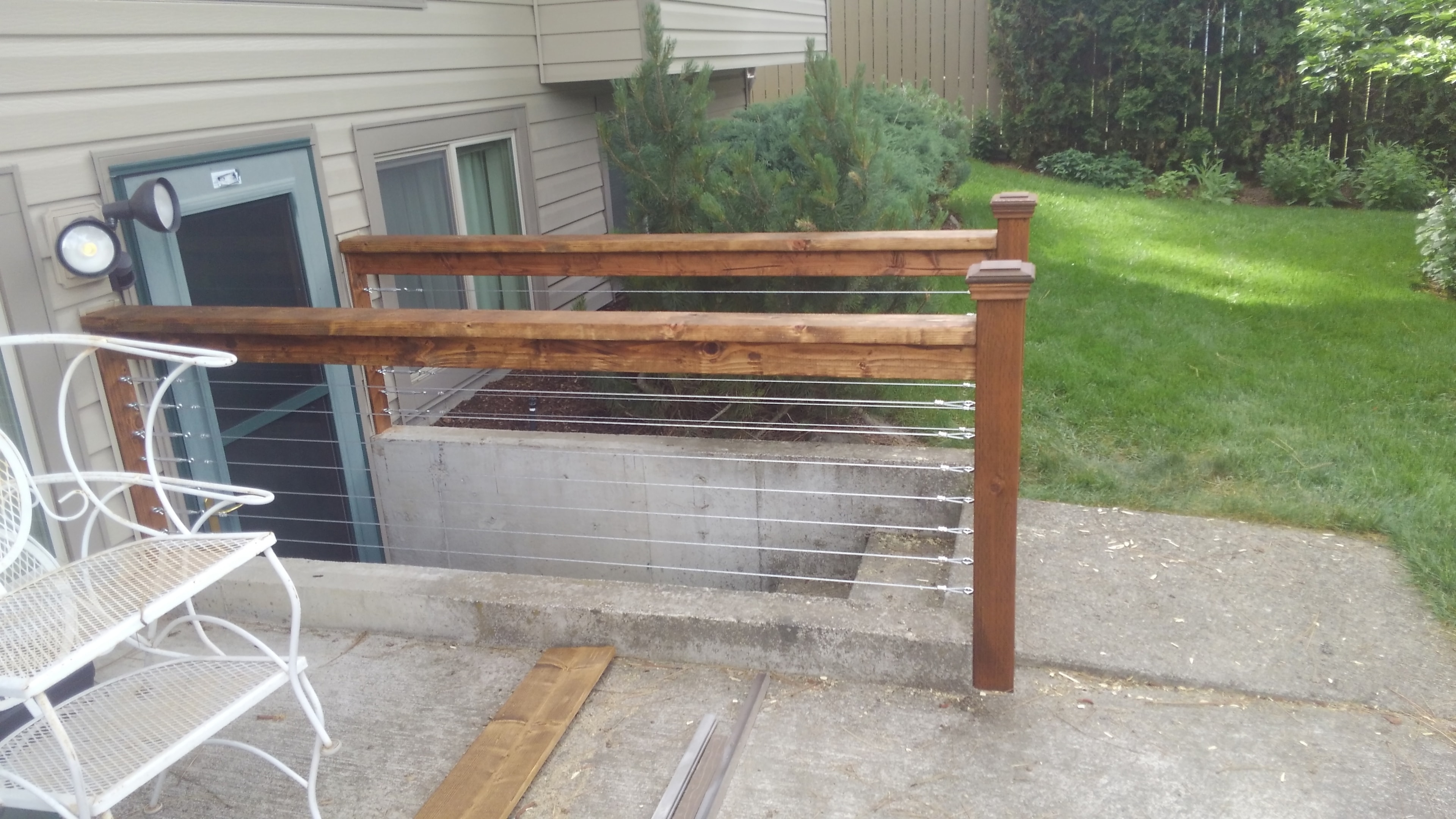 Composite deck with stainless cable railing