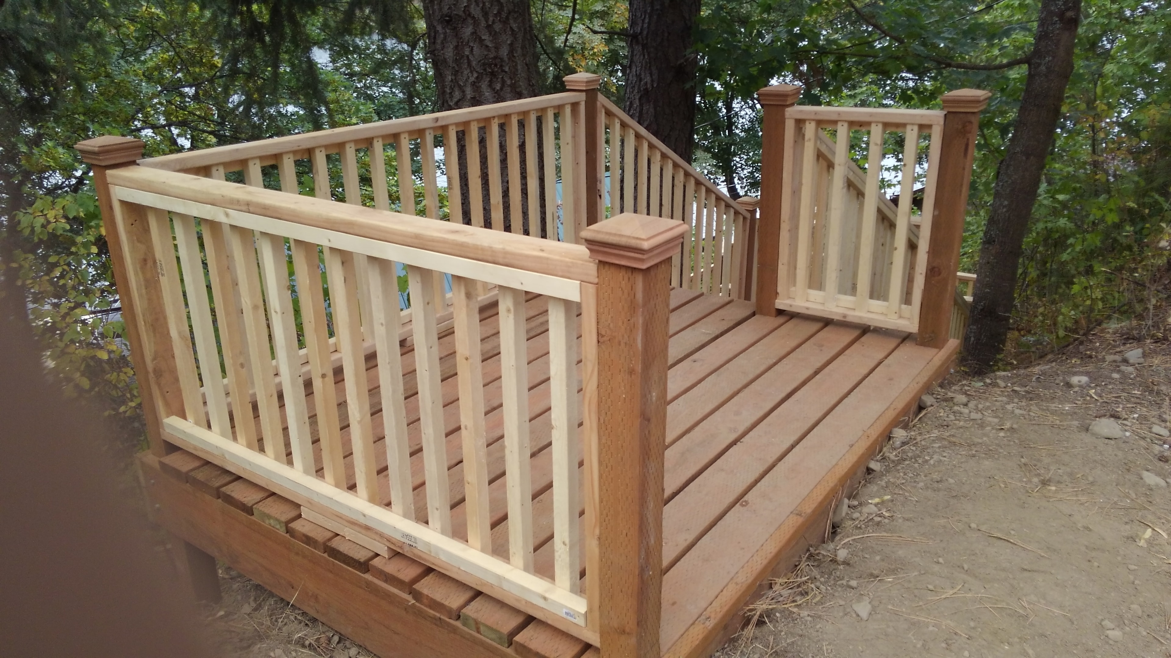 Completed cedar deck with decorative post caps