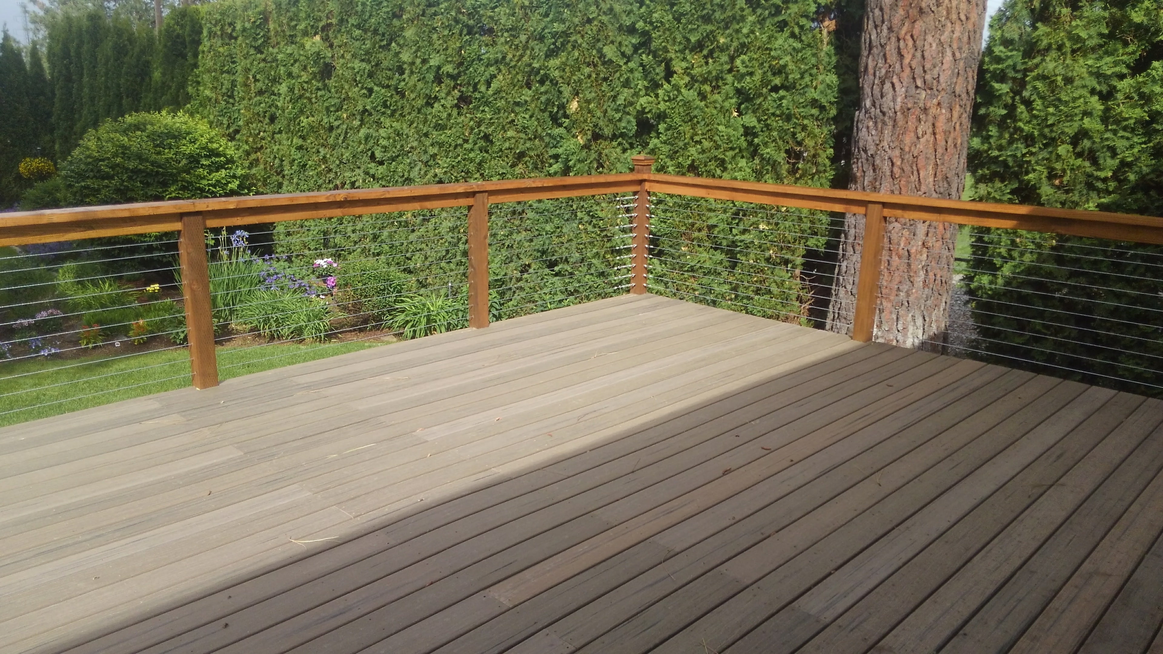 Composite decking with cedar posts and cable railing