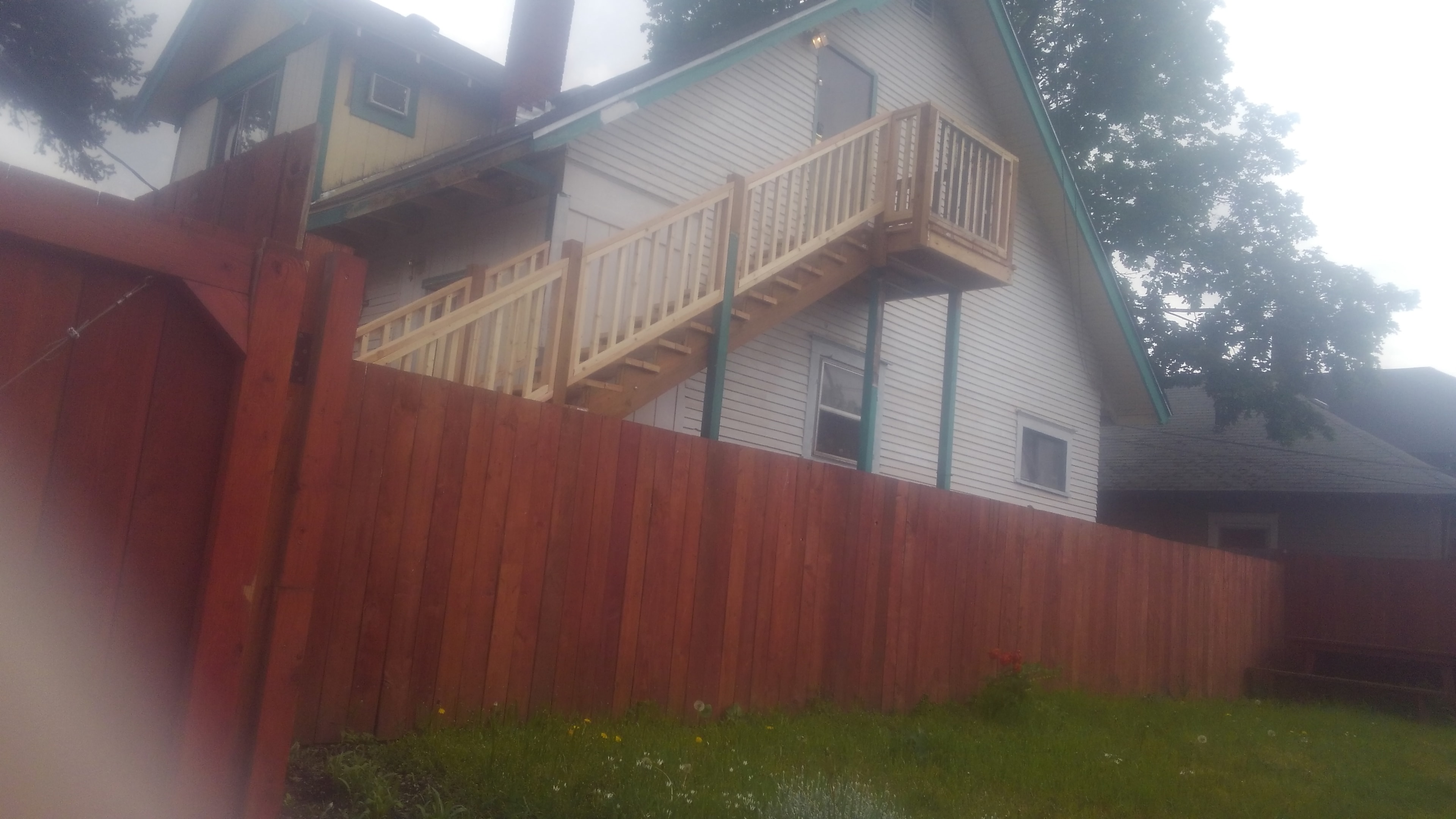 Completed covered porch with Urann's sign