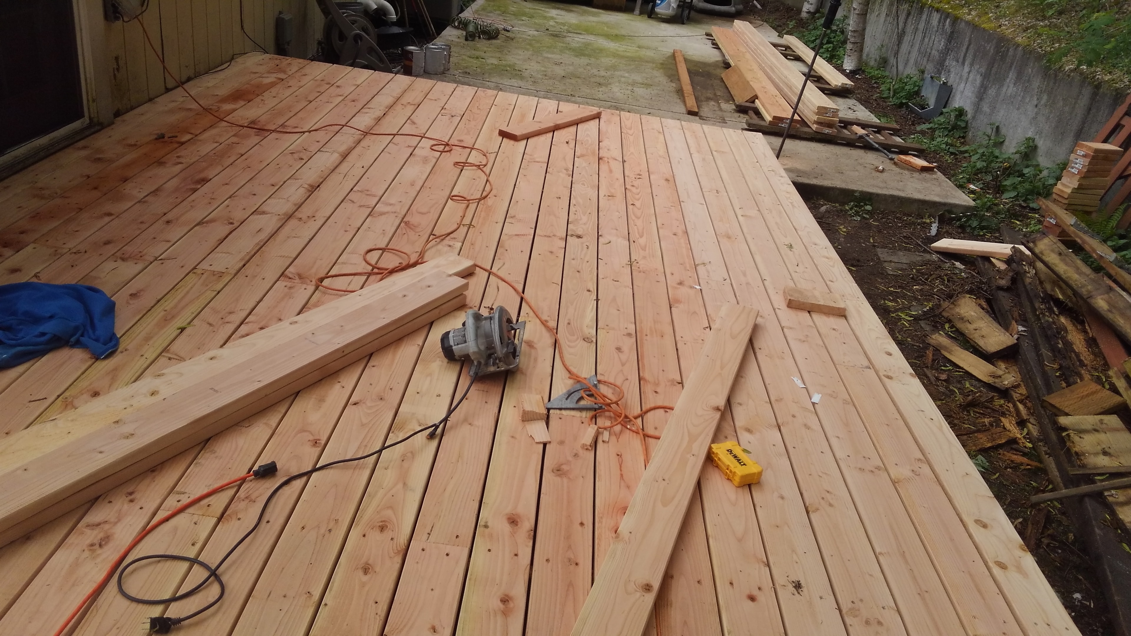 Deck rebuild — fresh cedar decking being laid