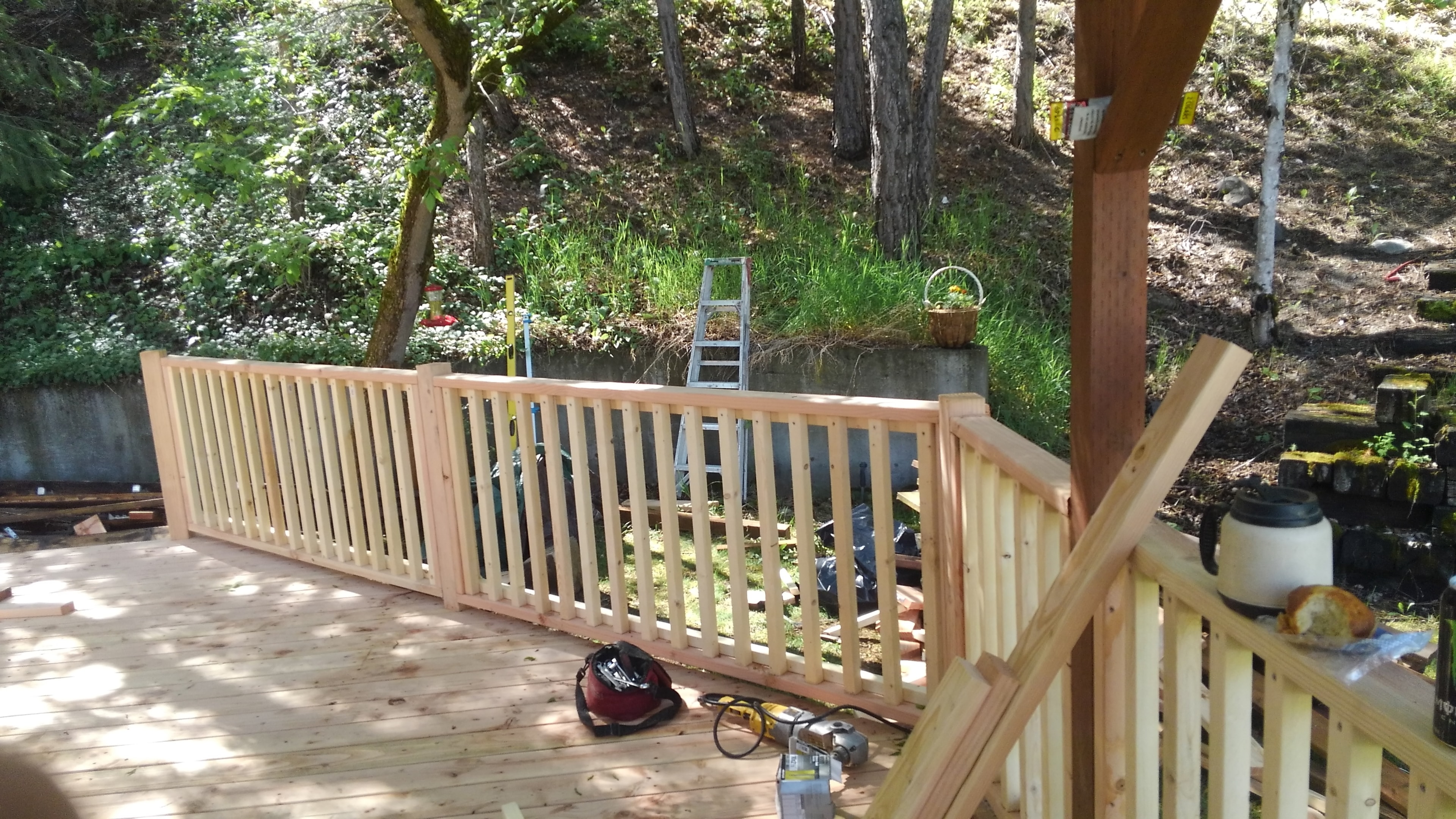 Deck rebuild — new cedar railings going up