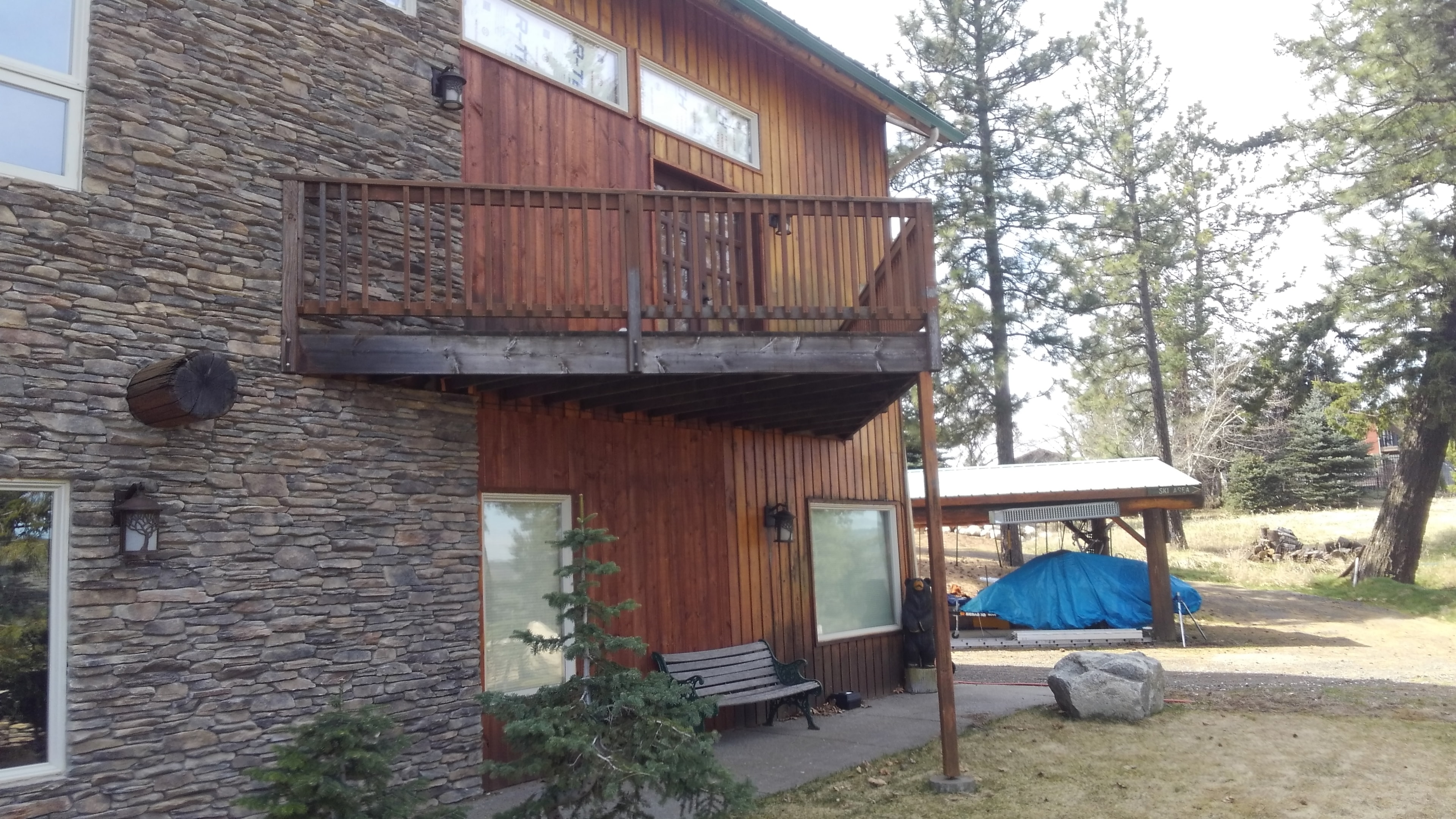 Lodge upper deck with cedar siding