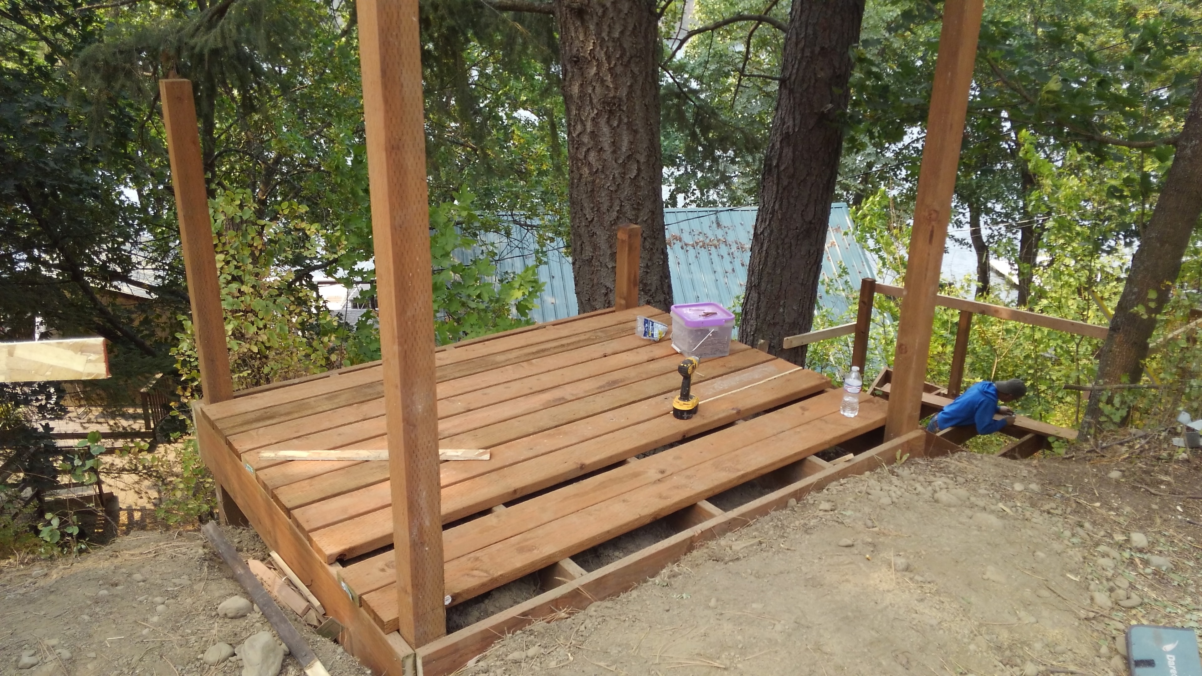 Wooded hillside deck framing in progress